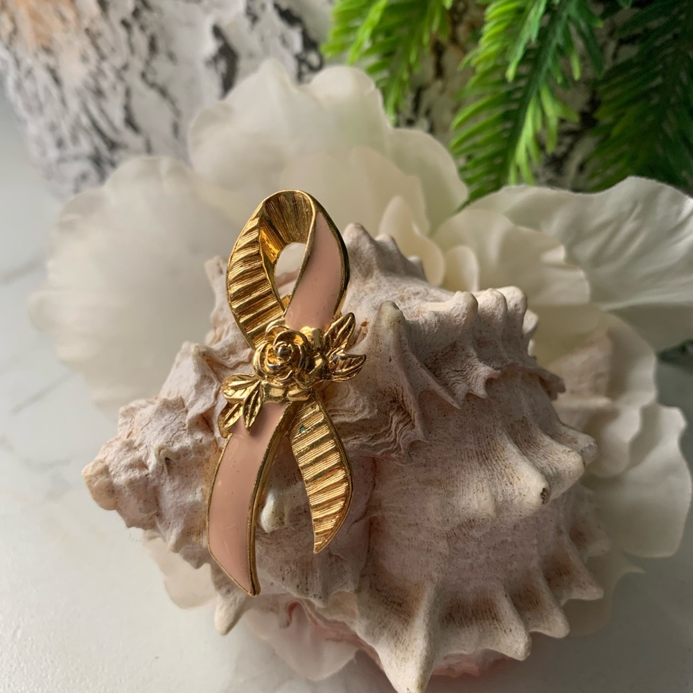 Vintage "Pink ribbon" gold tone brooch by Avon.